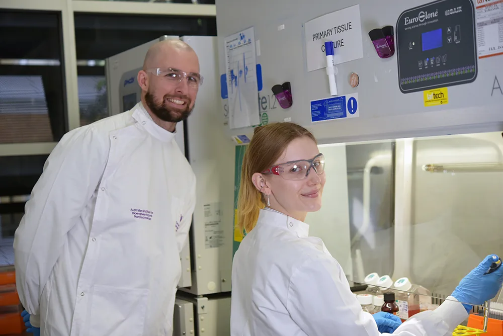 Dr Liam O&rsquo;Brien and Hannah Tompkins in the cancer vaccine laboratory at AIBN
